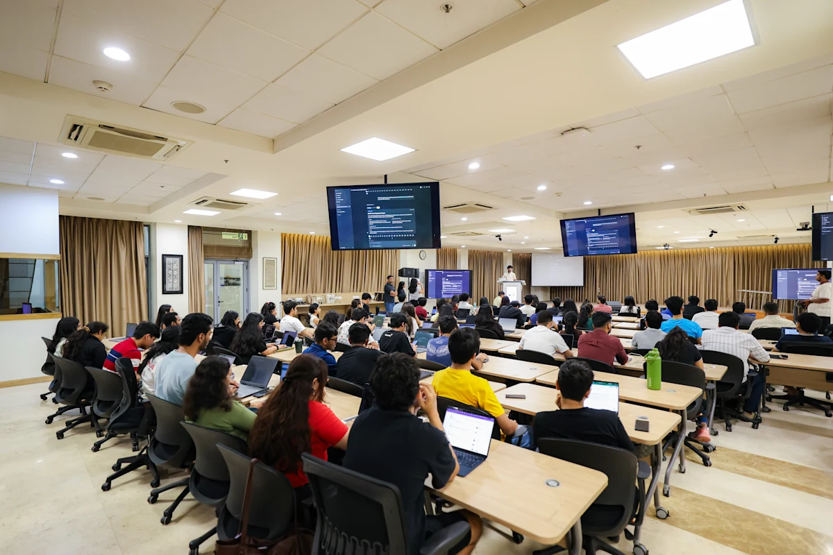 Students attending an OpenAI workshop in a lecture hall.